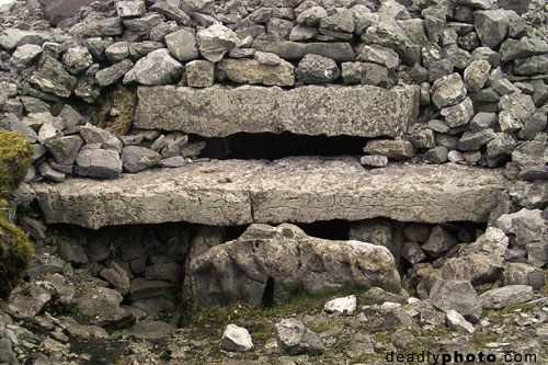 Exterior of Cairn G, with entrance stone, Carrowkeel