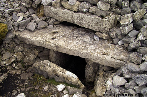 Exterior of Cairn G, with entrance stone, Carrowkeel