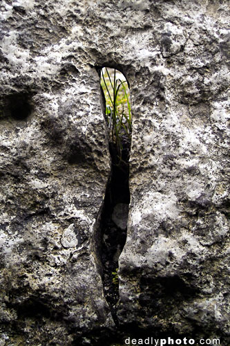 The strange aperture in the Cairn G entrance stone, Carrowkeel