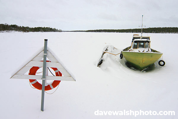 Boat on frozen lake, Nellim, Lapland, Finland