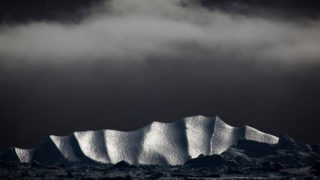 Iceberg under cloud, Kangerdlussuaq Fjord, East Greenland