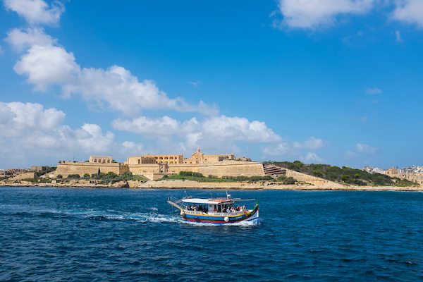 Tourist boat passing Manoel Island, Malta