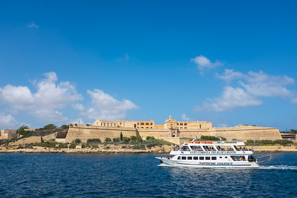 Tourist boat passing Manoel Island, Malta