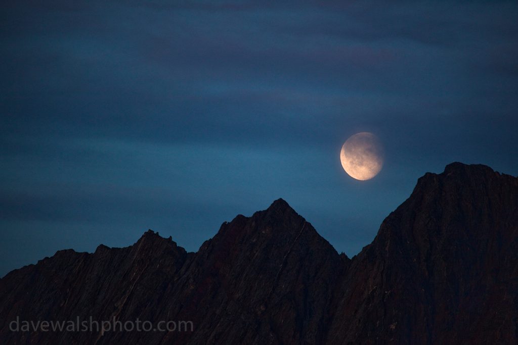 Moon rising over mountains in Nugatsiaq, Baffin Bay, Greenland