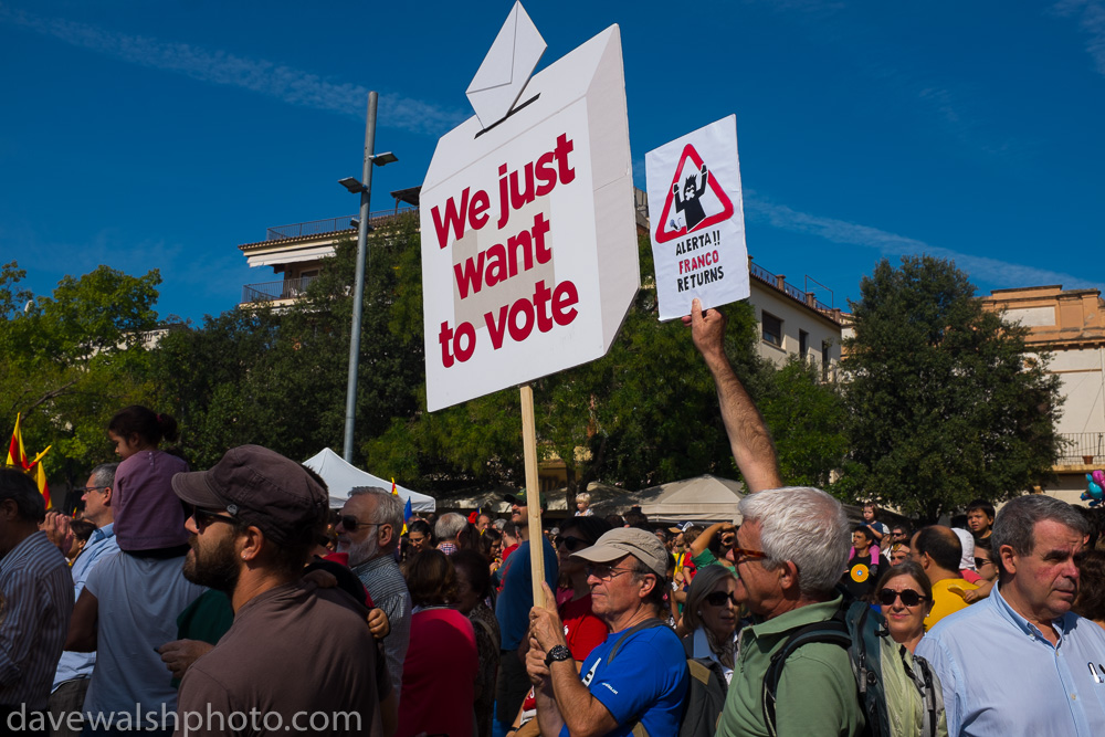 We Just Want to Vote - Franco Returns. During a pre referendum social event in Placa Octavia, Sant Cugat del Valles, with dancing and other traditional activities, including castellets, the human towers, pro independence activists question the actions of th